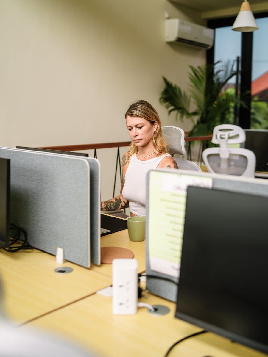 Ergonomic workstations with monitors on the private coworking floor at TheHub